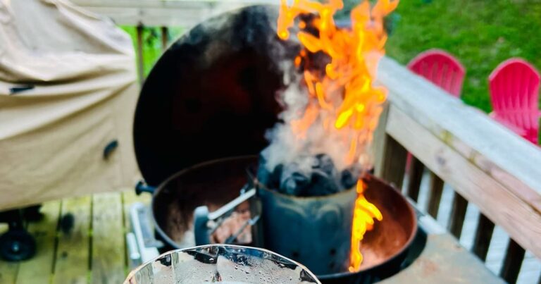 dad grilling with kids on a charcoal grill